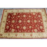 Indo Persian rug of Ziegler design with an all-over palmette pattern on a red ground, with beige