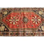 Modern South West Persian rug with a triple medallion and all-over stylised floral and bird design