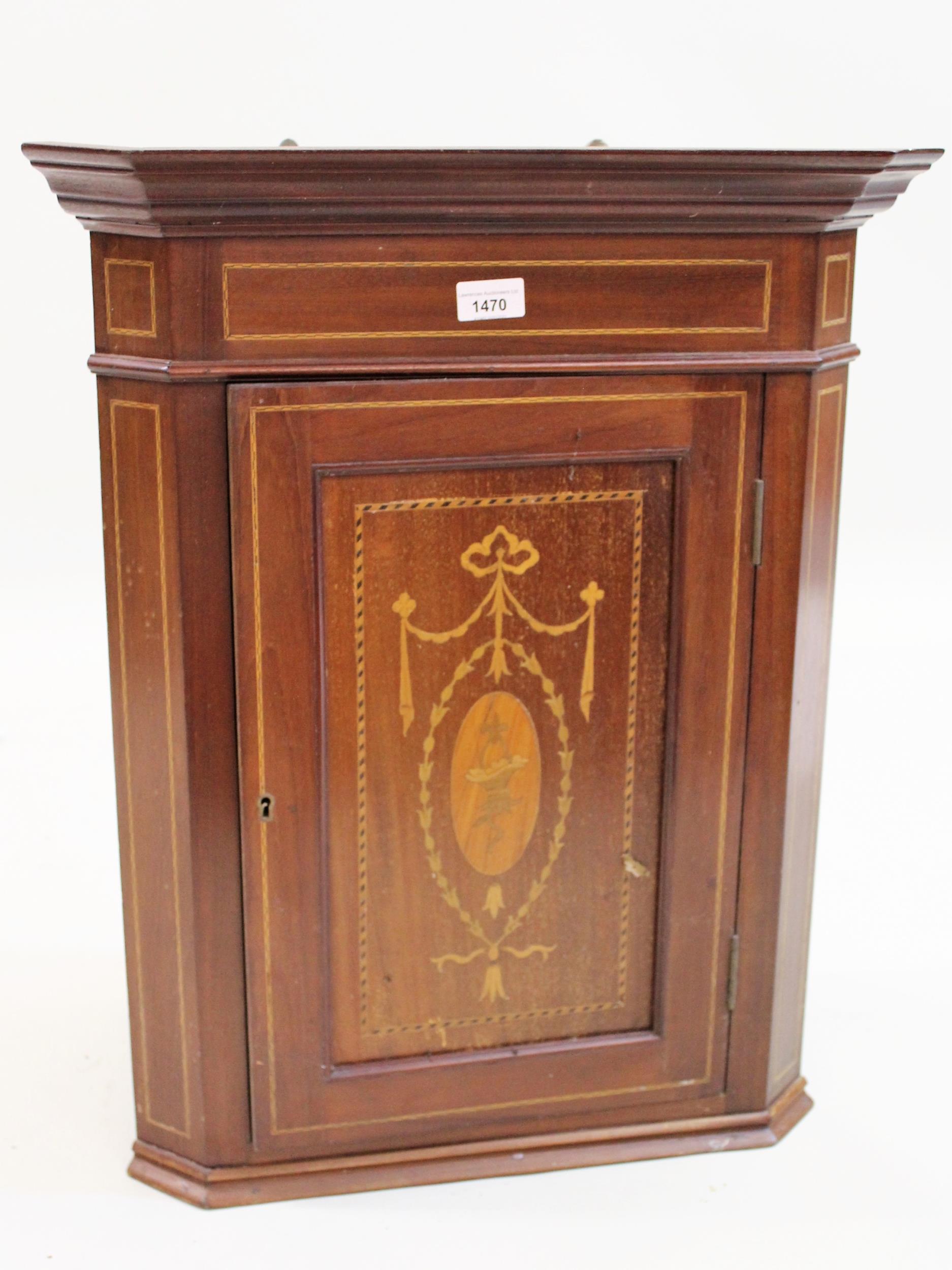 Small Edwardian mahogany and marquetry inlaid hanging corner cabinet with a single panel door, 65cms