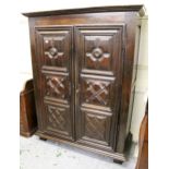 18th / 19th Century French oak armoire, the moulded cornice above two three panel doors with