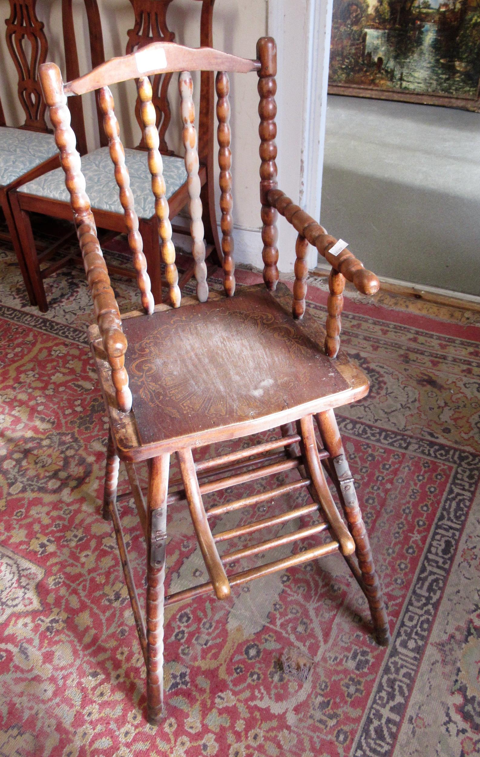 Late 19th / early 20th Century child's high chair with embossed seat, bobbin turned back and