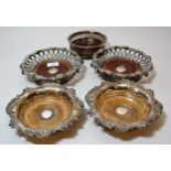 Pair of good quality silver plated bottle coasters with grapevine borders, together with a pair of