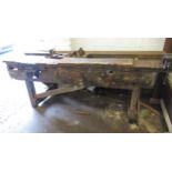 Large wooden work bench with two integral vices, 223cms wide