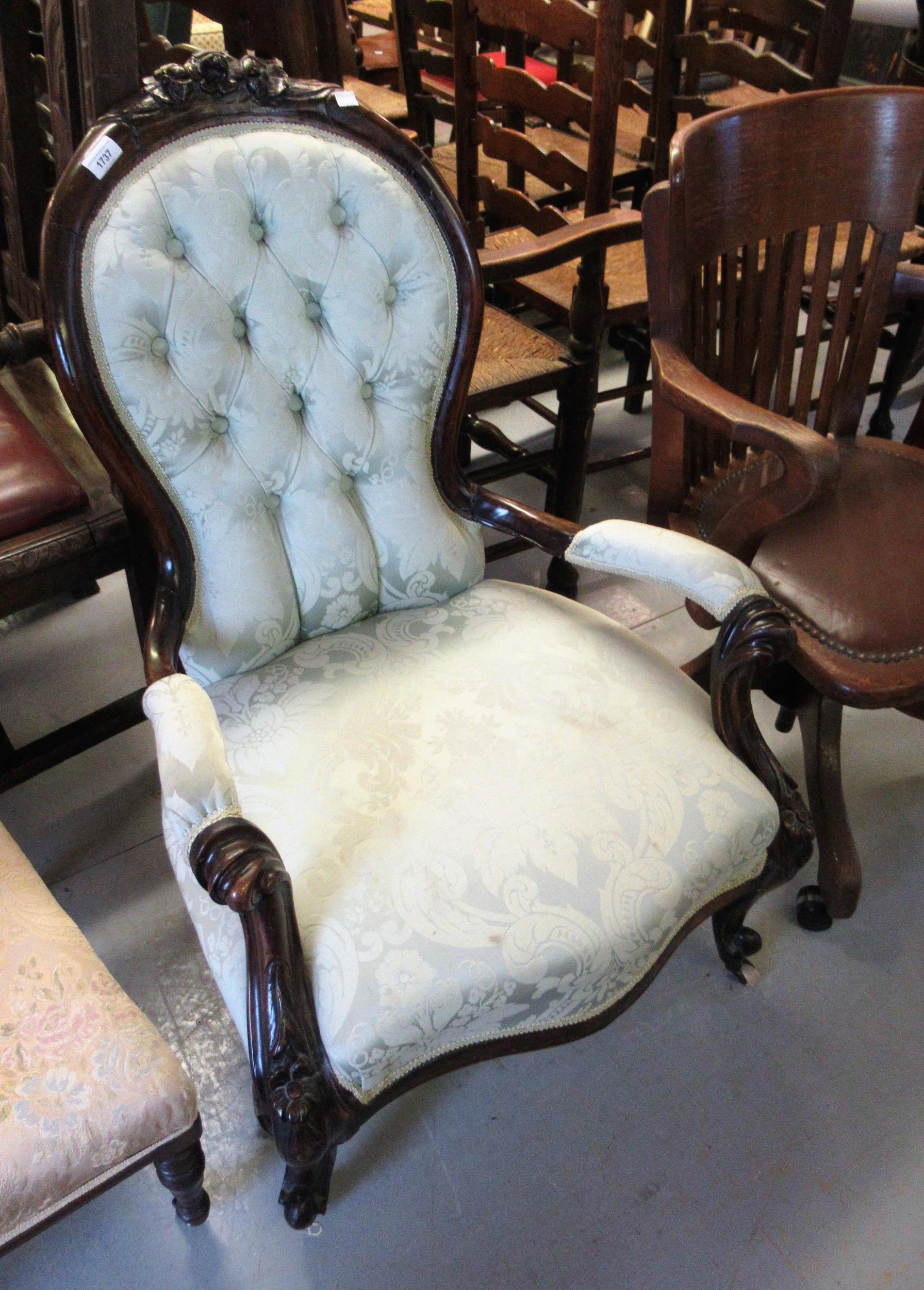 19th Century mahogany spoon back open armchair having green damask button upholstered back,