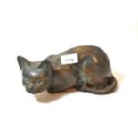 Modern dark patinated bronze figure of a cat, 23cms wide