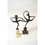 Patinated metal figure of a dancing girl on marble plinth, and another patinated metal dancing