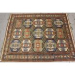 Indo Persian rug with a polychrome hooked medallion design and borders, 211cms x 180cms