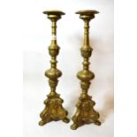 Pair of brass candle stands in 17th Century Dutch style, 62cms high Slightly out of shape, poorly