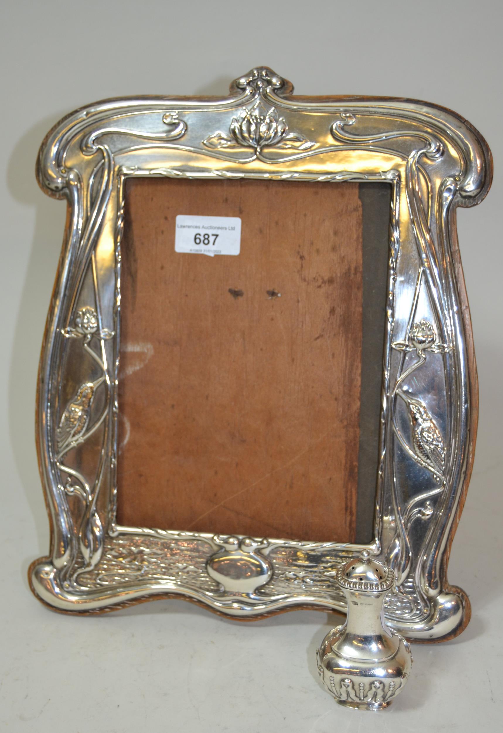 Art Nouveau silver photograph frame, embossed with kingfishers, together with a silver pepper