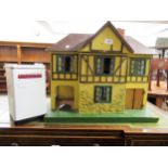 Mid 20th Century Tri-ang dolls house with a quantity of period furniture, together with a dolls