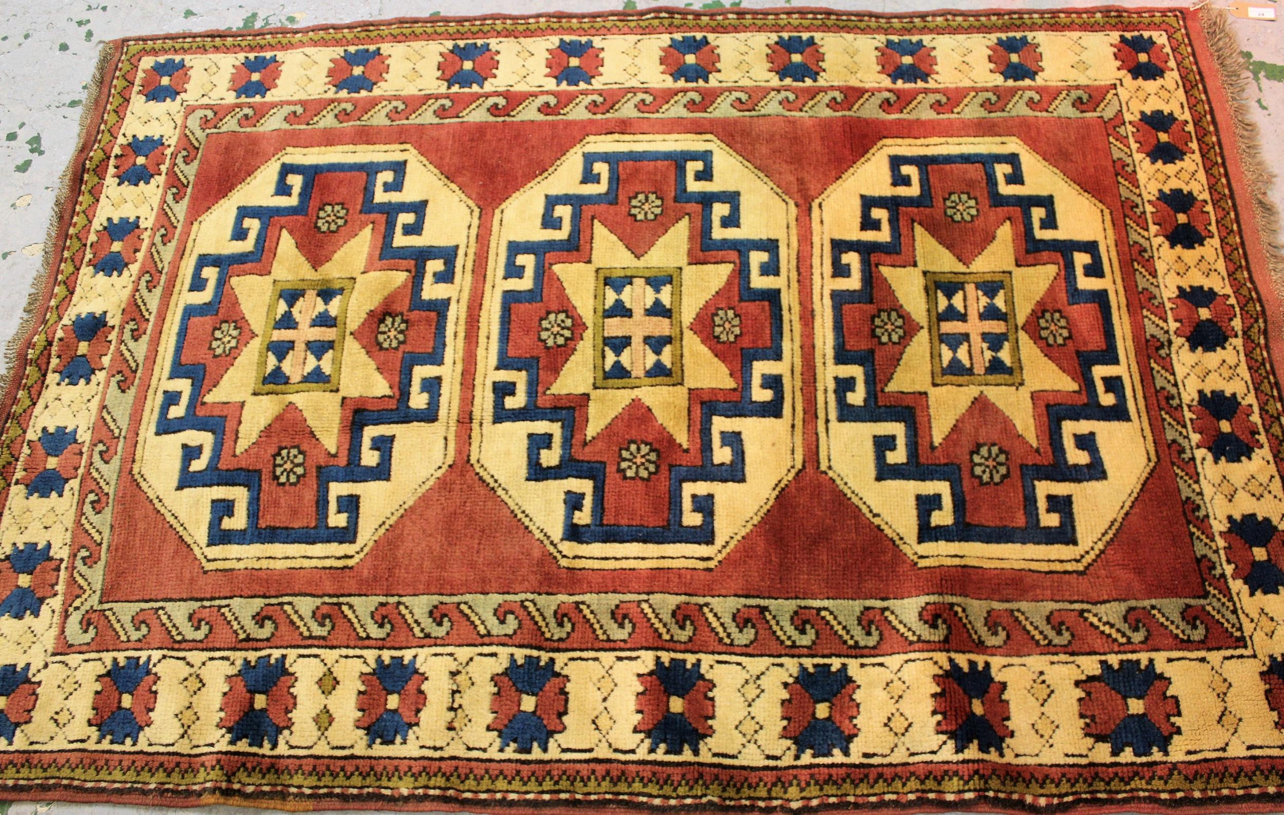 Small modern Turkish rug with a triple hooked medallion design on a rose ground with borders, 170cms
