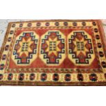Small modern Turkish rug with a triple hooked medallion design on a rose ground with borders, 170cms
