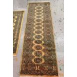 Small Pakistan Bokhara design rug with a single row of gols on a beige ground, 117cms x 80cms