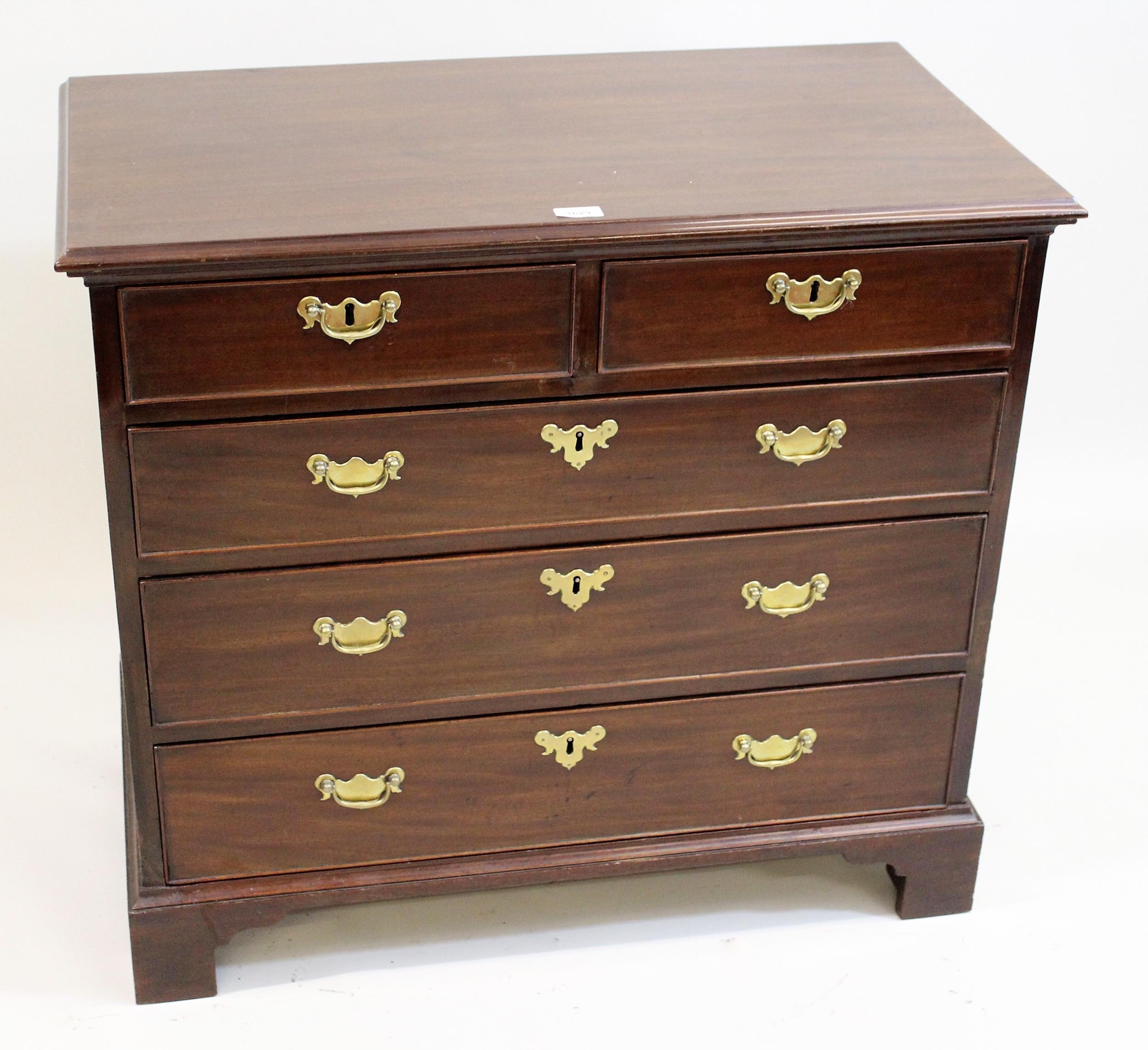 George III mahogany dwarf chest, the moulded top above two short and three long graduated drawers