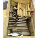 Wooden box containing a collection of various antique moulding planes