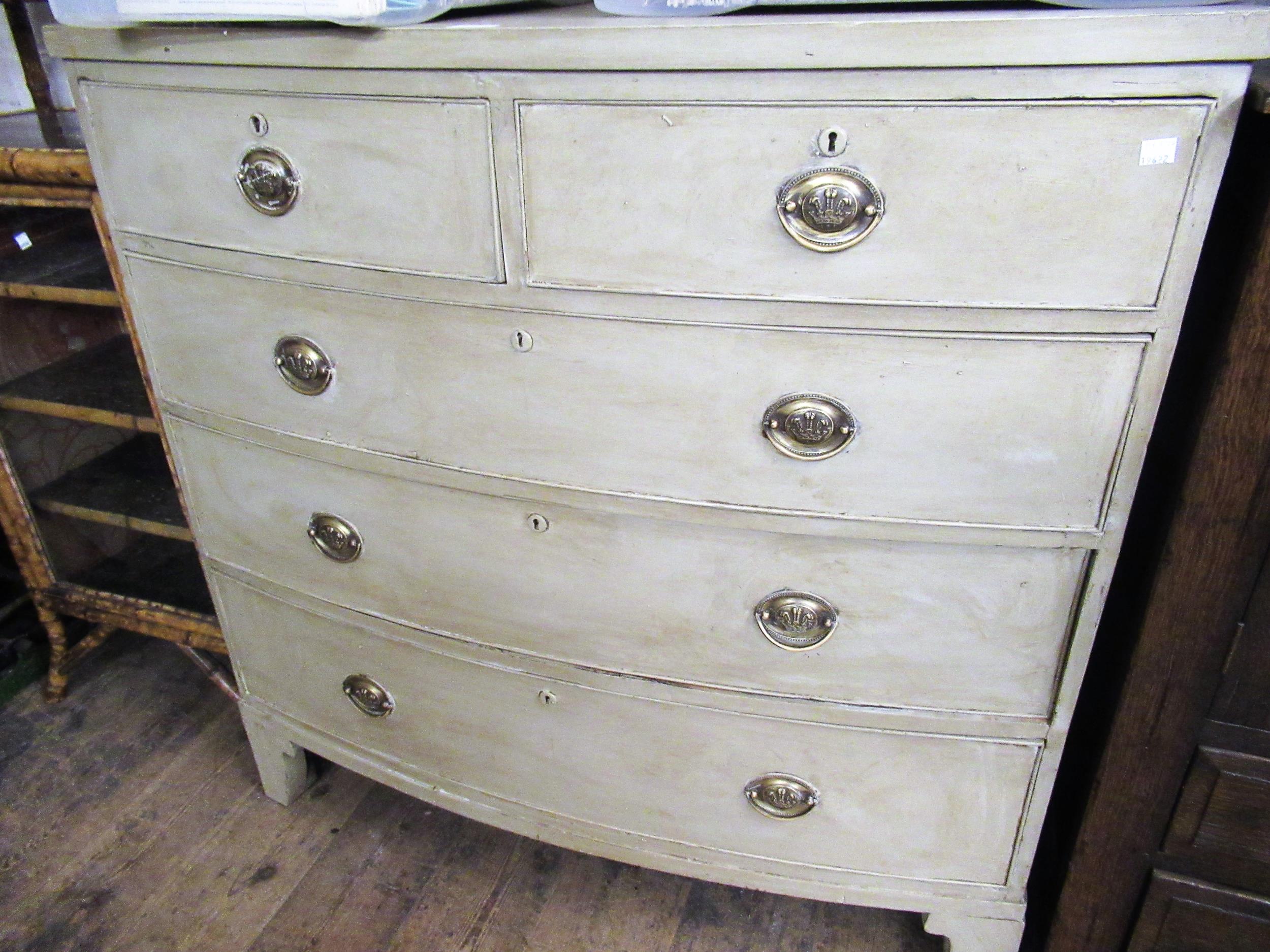 19th Century mahogany bow front chest of two short and three long graduated drawers with oval