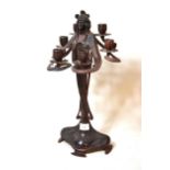 Reproduction dark and red patinated bronze candlestick of Art Nouveau design, 45cms high