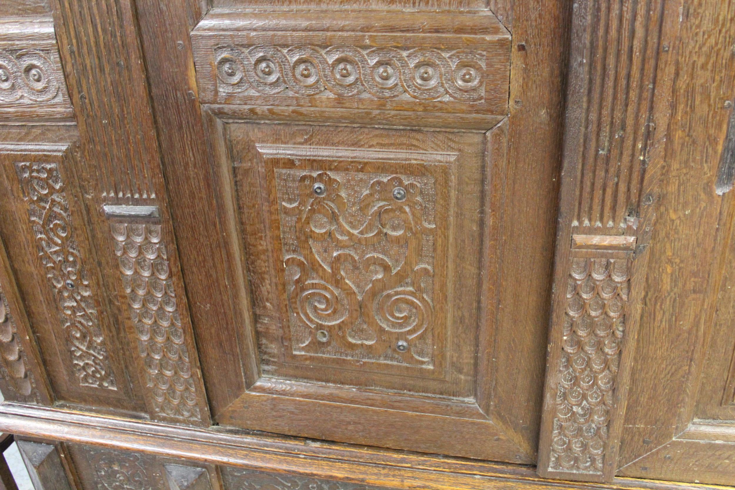 Continental oak armoire, the moulded cornice above a pair of carved fielded panelled doors flanked - Image 3 of 5