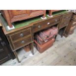 Edwardian mahogany boxwood and ivorine line inlaid inverted breakfront writing desk, the green