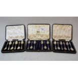 Two cased sets of six silver coffee spoons and another cased set of six spoons with matching sugar