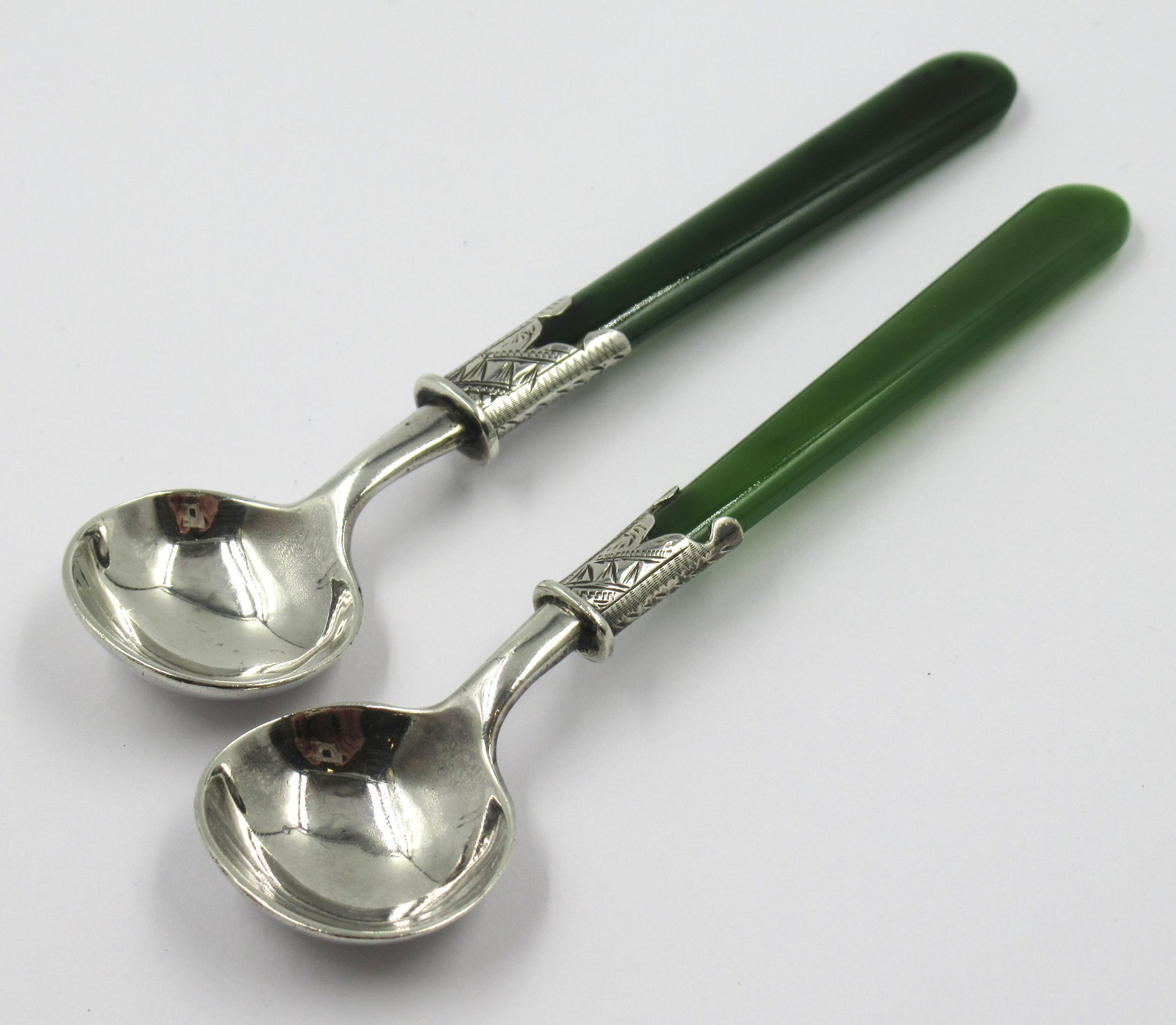 Pair of Victorian silver mounted salt spoons with green stone handles