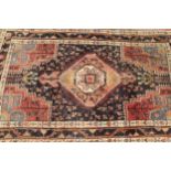 Hamadan rug with a lobed medallion and all-over design with corner designs and borders, 205cms x