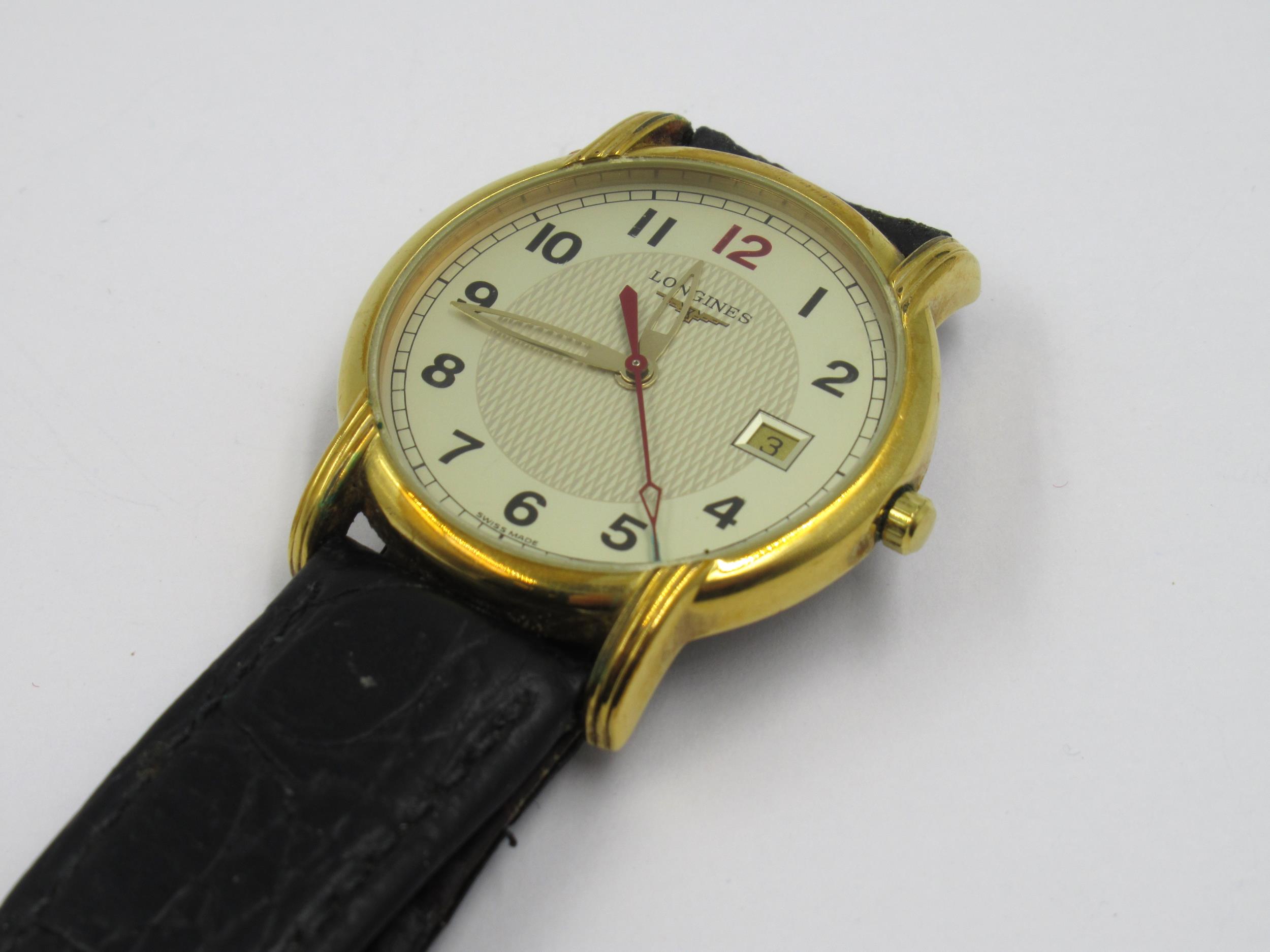 Gentleman's Longines circular gold plated quartz wristwatch, with leather strap Not currently