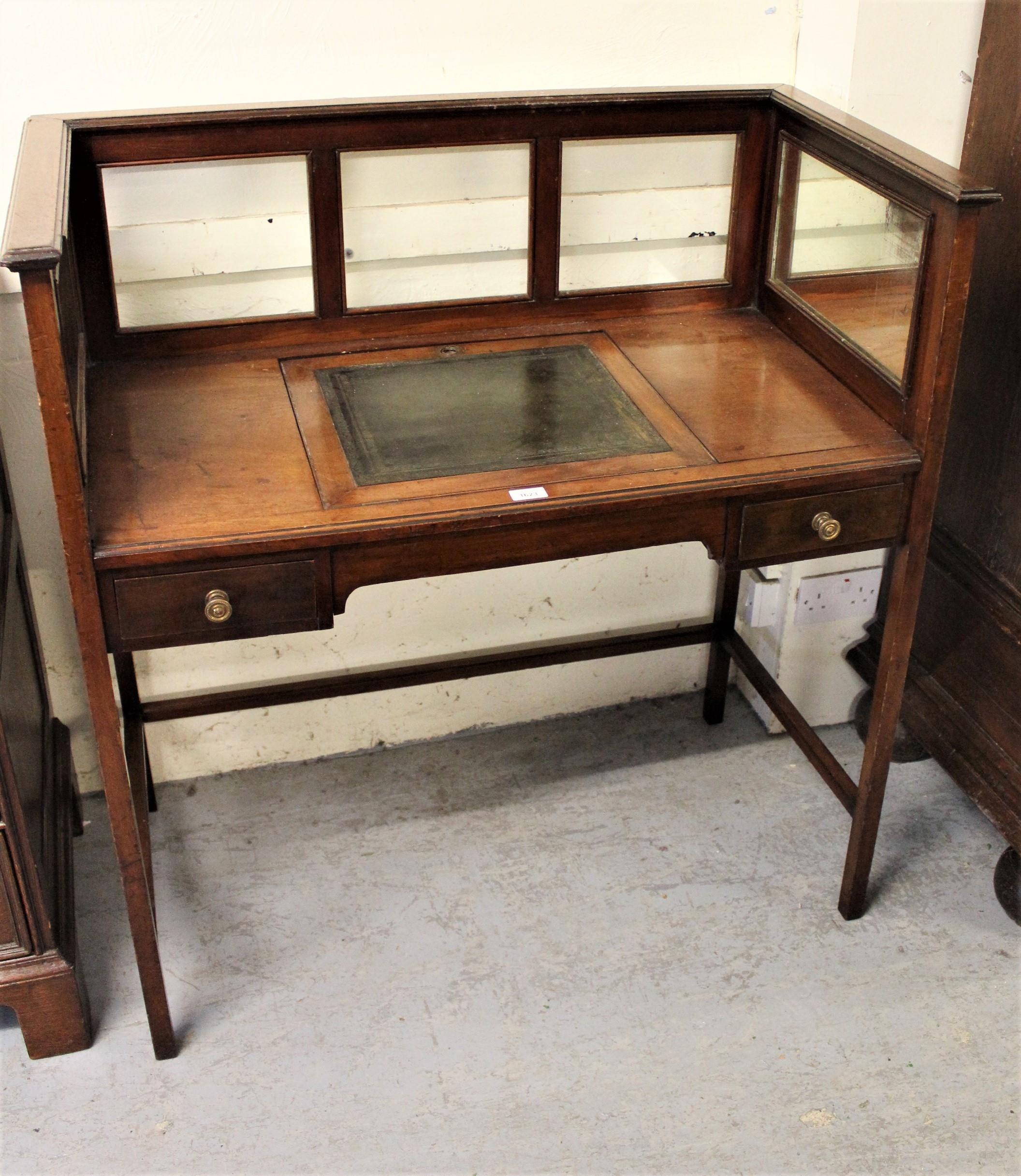 Edwardian mahogany writing table having mirrored and clear glass galleried top with central green