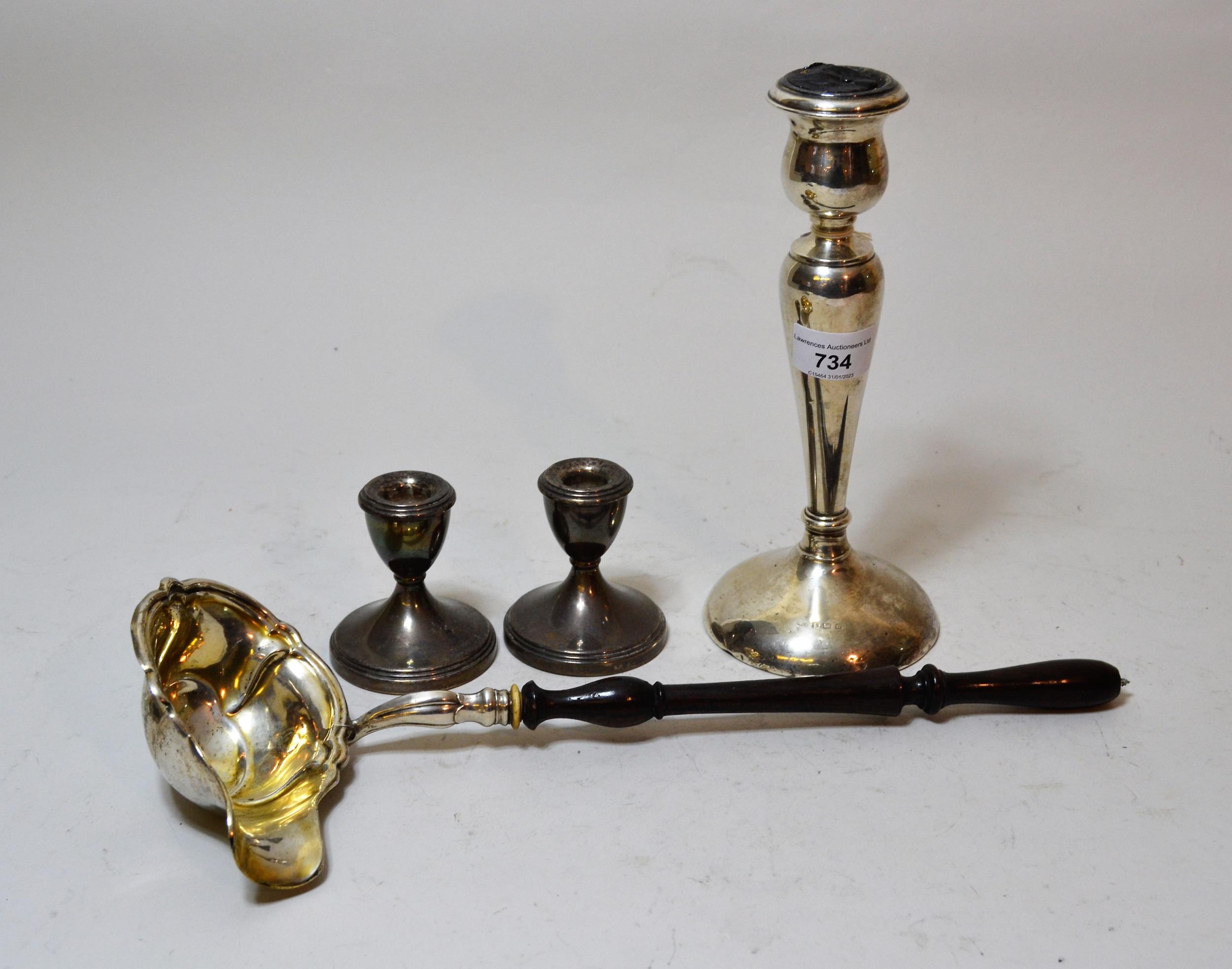 Birmingham silver baluster form candlestick and a pair of silver taper sticks, together with a