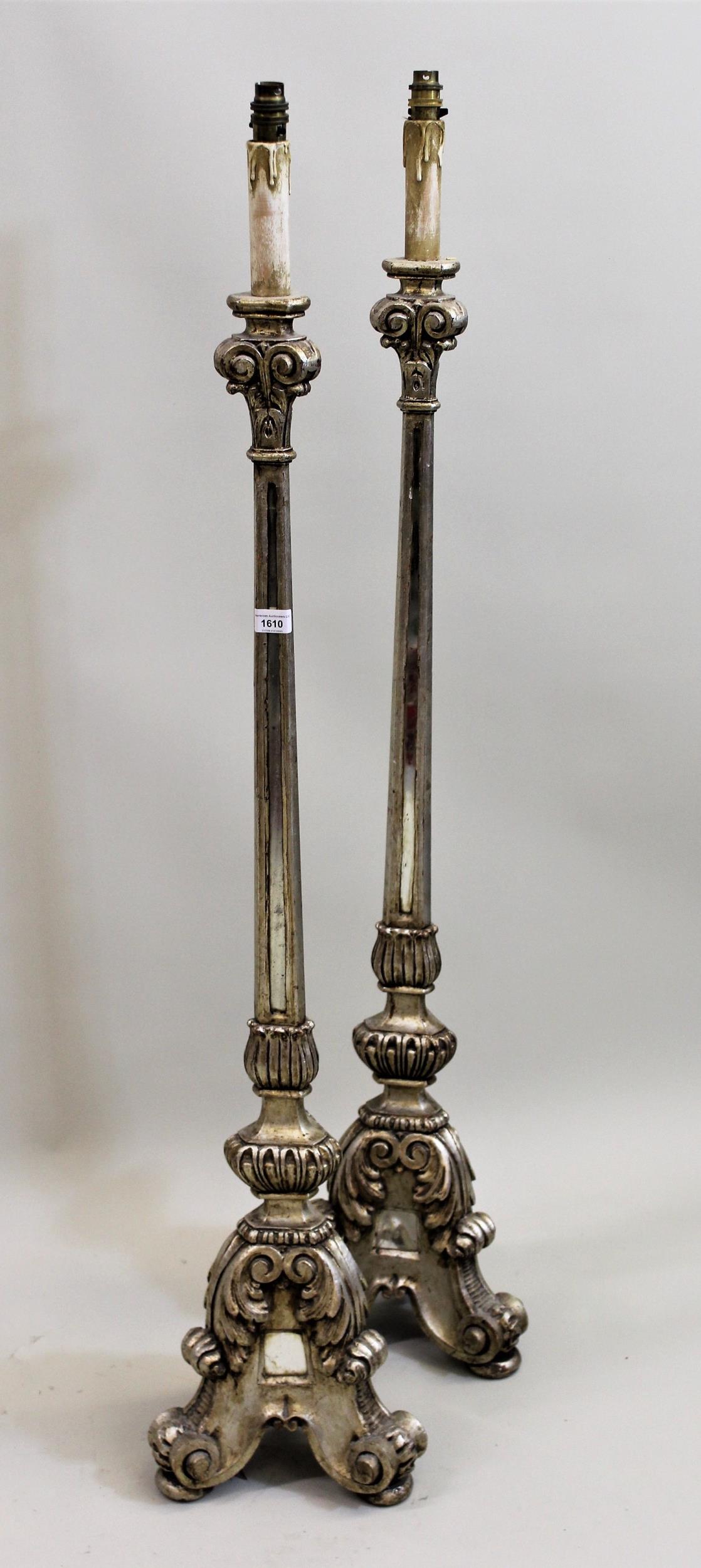 Pair of silvered and mirror inset lamp standards, with triform bases in 17th Century Dutch style,