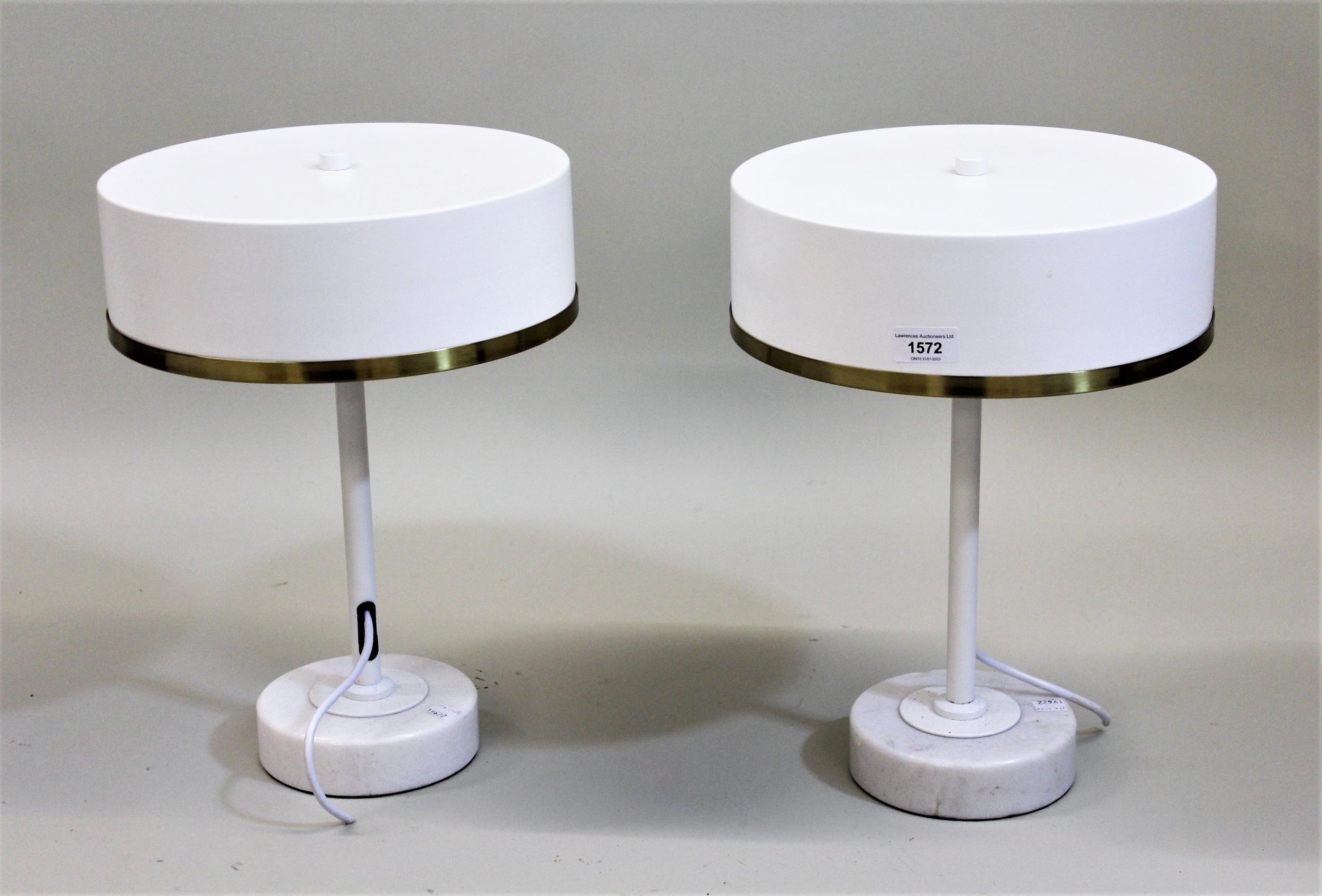 Pair of modern drum form table lamps in mid Century style finished in white, the metal brass mounted