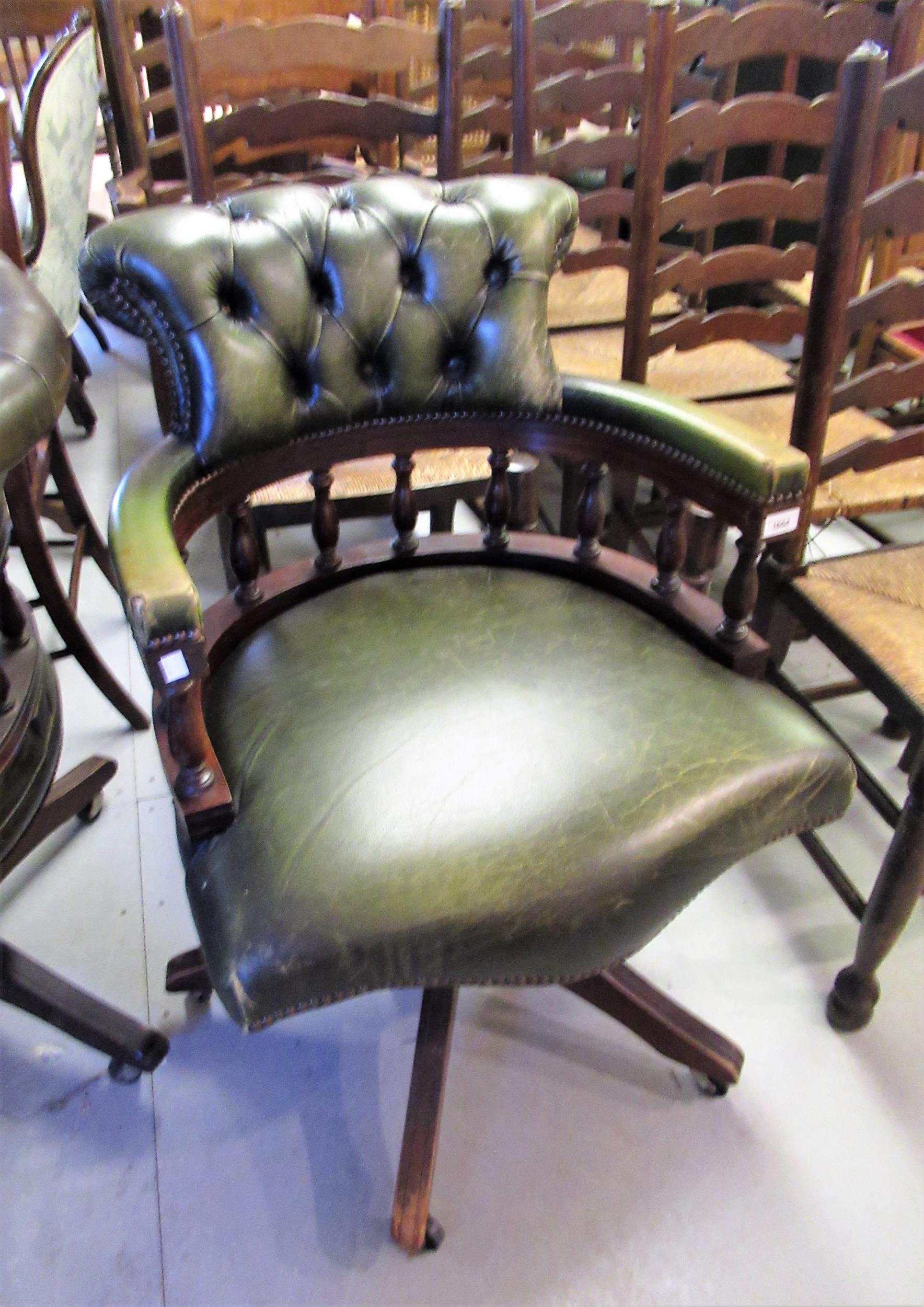 Reproduction green button leather upholstered and mahogany revolving office chair