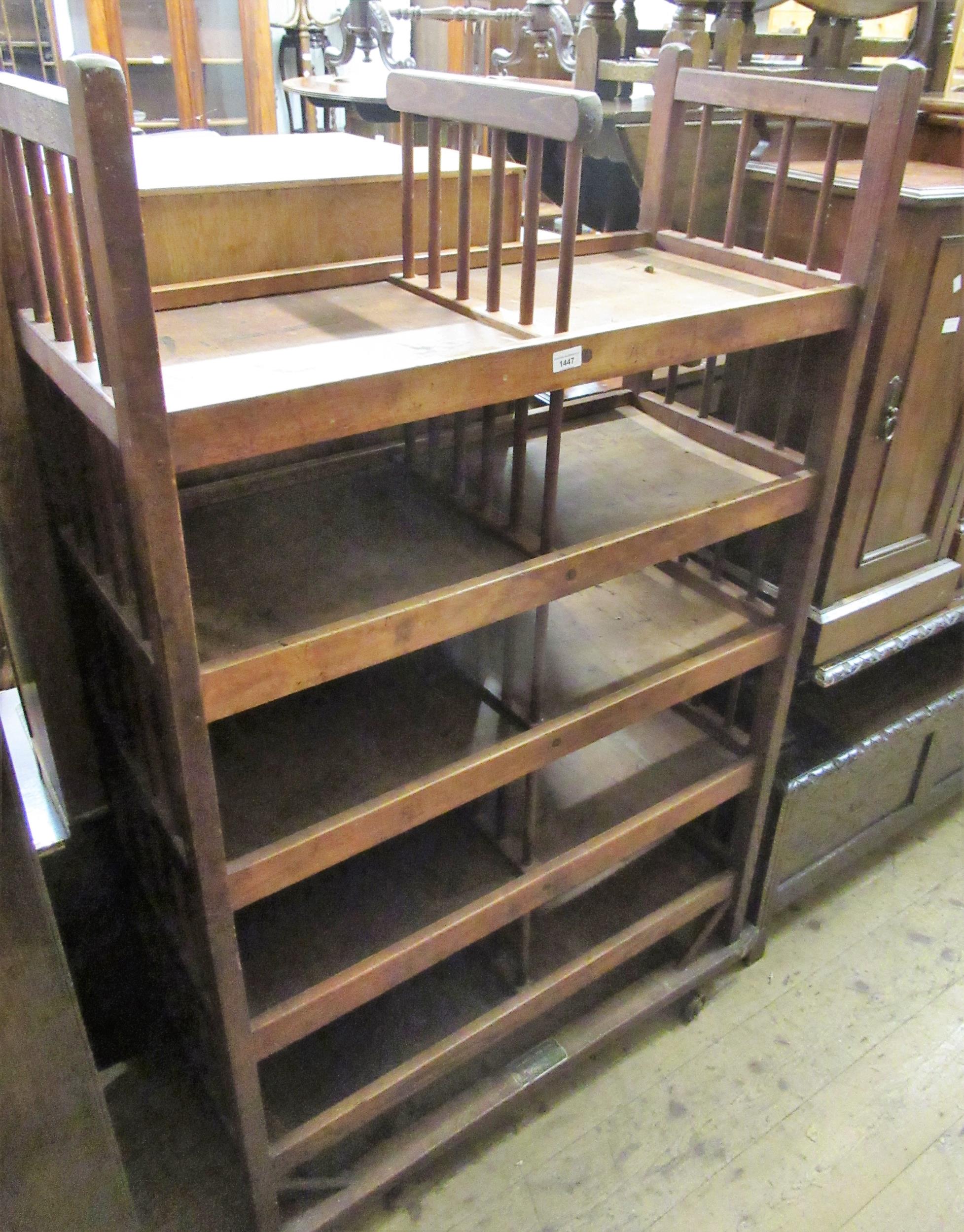 Late 19th / early 20th Century American industrial five shelf shoe rack with original metal casters,