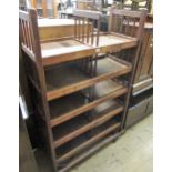 Late 19th / early 20th Century American industrial five shelf shoe rack with original metal casters,