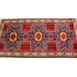 Small modern Turkish rug with a triple medallion design in shades of red and blue, 193cms x 98cms