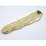 Triple row cultured pearl necklace with 9ct gold clasp