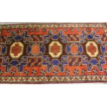 Small modern Turkish rug with a triple medallion design in shades of red and blue, 196cms x 103cms