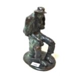 20th Century dark and green patinated bronze figure of a seated man, 25cms high