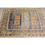Modern Turkish carpet with a geometric animal and stylised floral design on a pale blue ground