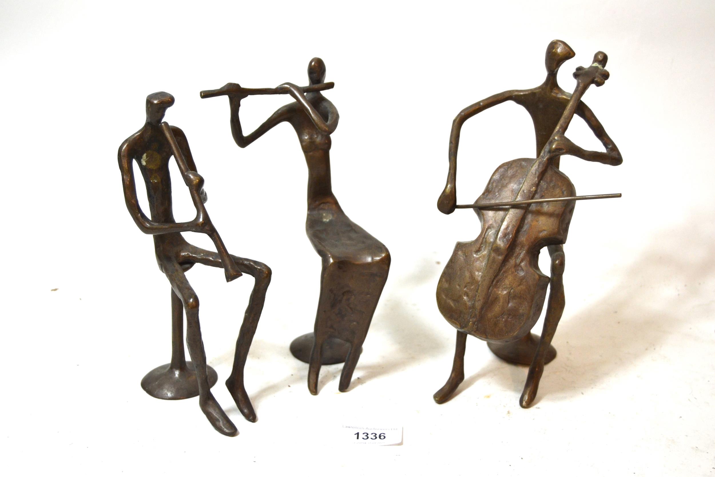 Group of three mid 20th Century dark patinated bronze figures of musicians in stylised form, the