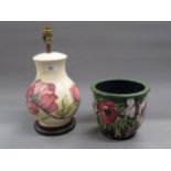 Modern Moorcroft baluster form table lamp in the Hibiscus design, with a cream ground, 25cms high