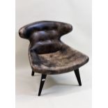 Andrew Martin, a pair of buttoned leather upholstered butterfly back side chairs 40cms to centre
