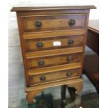 Reproduction yew wood four drawer bedside chest and a Victorian button upholstered low seat chair