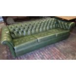 20th Century green buttoned leather upholstered three seater Chesterfield type sofa, 224cms wide x