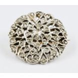 Unmarked white metal and rose cut diamond set flower head brooch, approximately 23mm diameter
