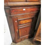 George III mahogany crossbanded line and lunette inlaid hanging corner cabinet, with a moulded