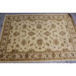 Indo Persian rug of Ziegler design with an all-over palmette pattern on a beige ground with borders,