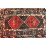 Modern Turkish rug with a twin medallion design in shades of dark blue and red, 180cms x 124cms