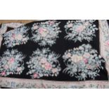 20th Century Aubusson style needlepoint wall hanging, with floral design on a black ground with