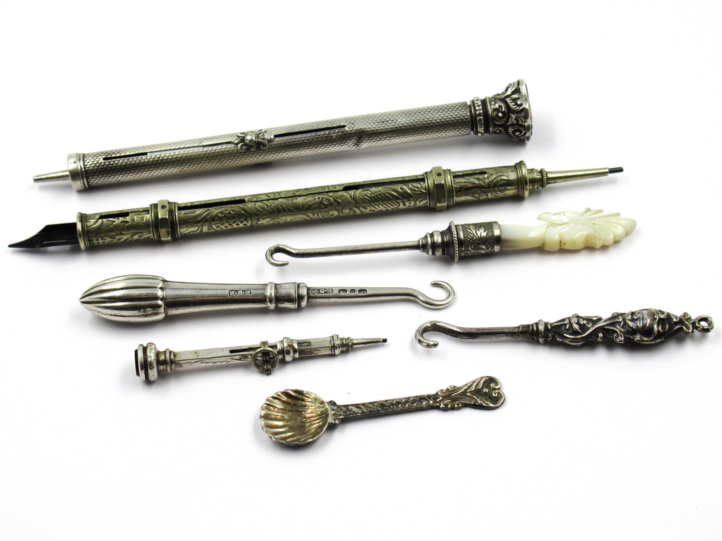 Silver cased propelling pencil, another plated pencil and various buttonhooks etc.